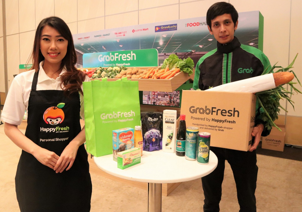 Grab meresmikan kehadiran layanan online grocery GrabFresh, hasil kolaborasinya dengan HappyFresh, siap bersaing dengan Go-Shop dan Go-Mart milik Go-Jek